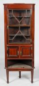 A 19th century George III style mahogany standing corner cupboard,