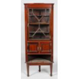 A 19th century George III style mahogany standing corner cupboard,