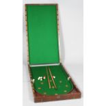A Victorian mahogany folding Bagatelle table, mounted with green baize,