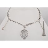A silver watch chain having an attached seal (stone missing), shield pendant & hammer charm.