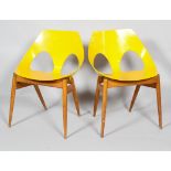 A pair of mid century Kandya yellow painted plywood chairs,