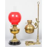 An Edwardian brass adjustable oil lamp on stand, early 20th century, stamped for Duplex,