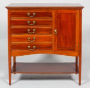 A mahogany music cabinet, 20th century, with five fall-front drawers and a panelled cupboard,