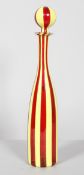 A Murano glass flask and stopper decorated in bands of yellow and red,