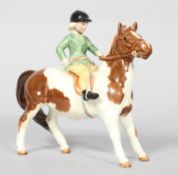A Beswick Horse and rider figure, 'Girl on a Pony', Skewball, model No 1499,