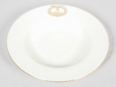 A German (Schonheit der Arbeit) porcealain soup plate, gilt with a reproduction of the Nazi cypher,