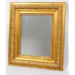 A late 19th century carved gilt and gesso rectangular wall mirror, later mirror plate,