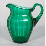 A late Victorian green glass panel cut oviform jug,