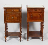 A matched pair of 19th century marble topped bedside cabinets,