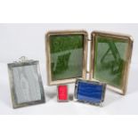 A velvet backed silver plain rectangular photograph frame, with bow tied ribbon cresting,