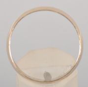 A yellow metal 7.0mm D shape wedding ring. Hallmarked 9ct gold, Sheffield, 1993.