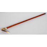 A carved horn mounted crook walking stick, circa 1900, the horn handle with metal collar,