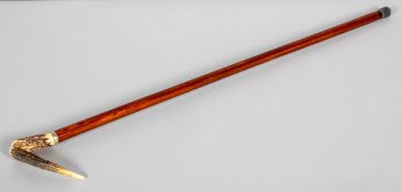 A carved horn mounted crook walking stick, circa 1900, the horn handle with metal collar,