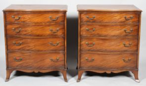 A pair of George III style mahogany chest of drawers, 19th century,
