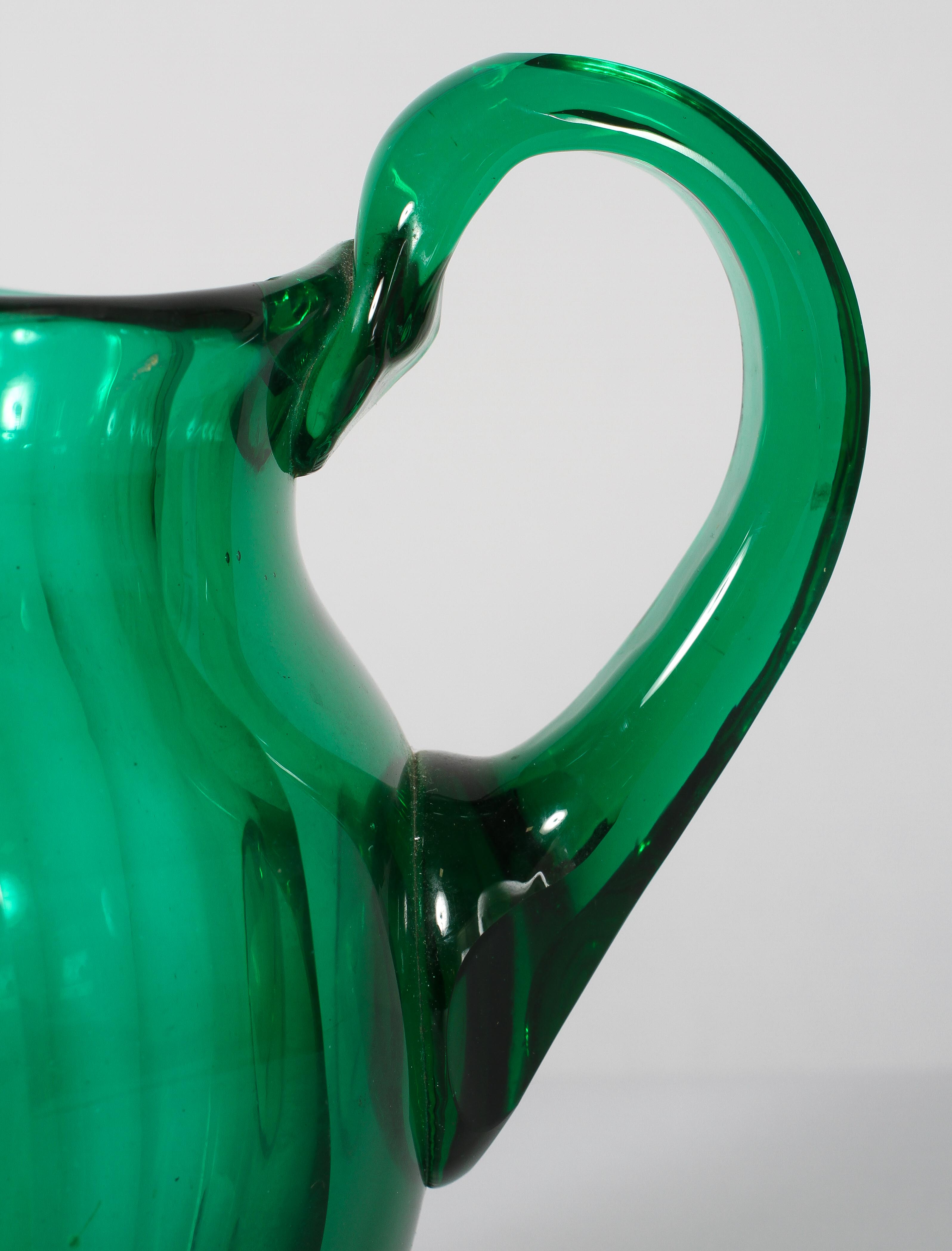 A late Victorian green glass panel cut oviform jug, - Image 2 of 2