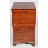 A George III mahogany inlaid four drawer chest, inlaid with satinwood stringing,