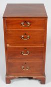 A George III mahogany inlaid four drawer chest, inlaid with satinwood stringing,