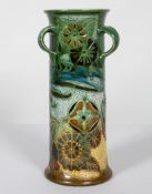 C H Brannam, Barum, three handle vase, decorated with a bird amongst foliage, signed and dated 1906,