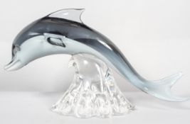 A large Murano glass dolphin, executed in grey/white cased glass, signed Elio Raffaeli to base,
