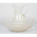 A Victorian cut glass water jug and basin, cut with diamonds, notches and lenses,