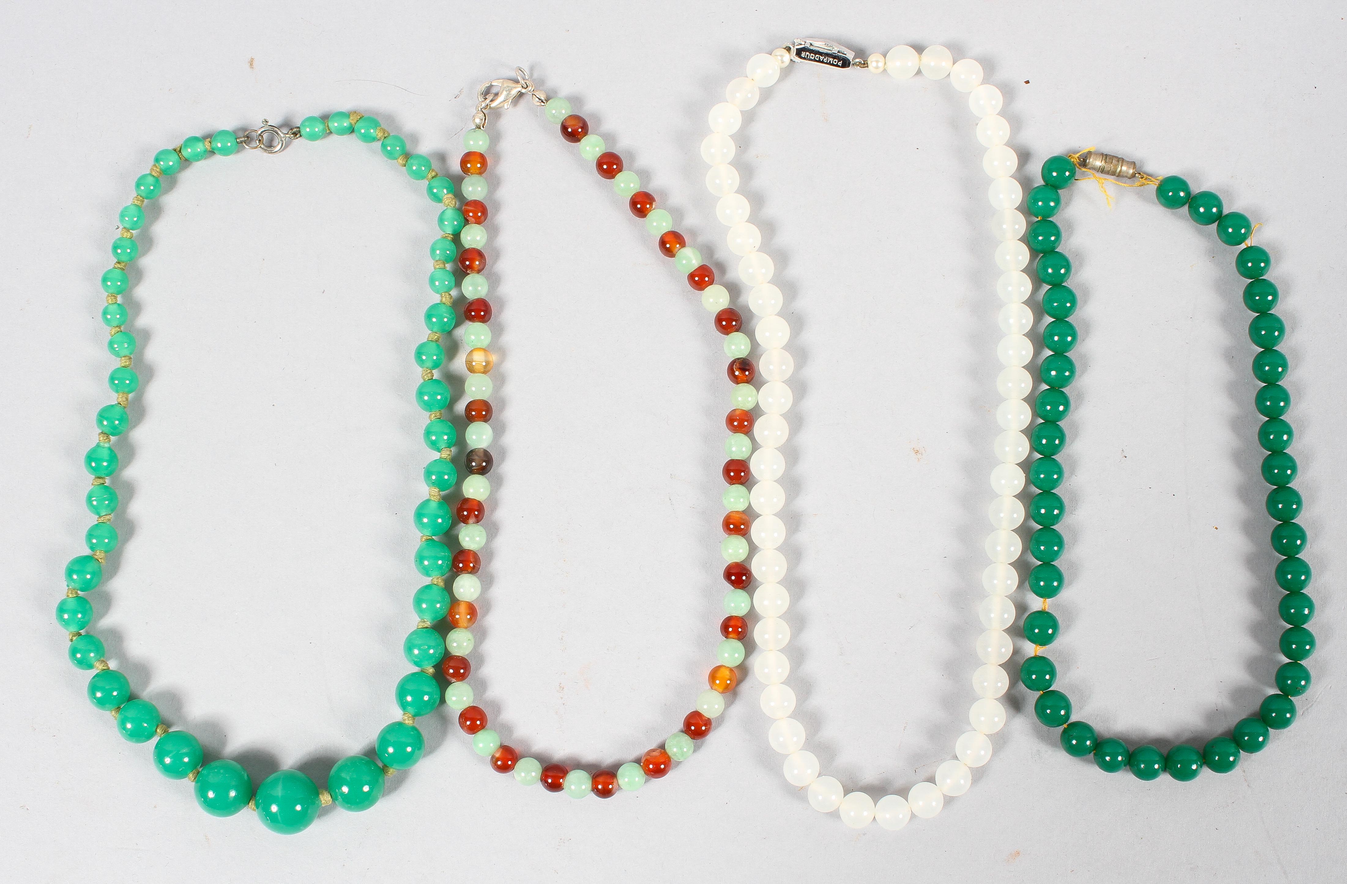 A collection of four beaded necklaces of variable designs together with an unstrung beaded necklace.