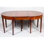 An early nineteenth century cross banded D-end demi-lune dining-table,