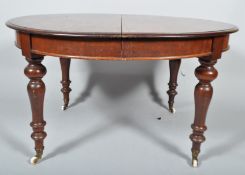A Victorian mahogany extending dining table,