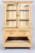 A Victorian pine kitchen dresser, the double glazed doors enclosing two adjustable shelves,
