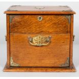 A Victorian oak tobacco cabinet, mounted with brass trefoil corner bracket, escutcheons and handles,