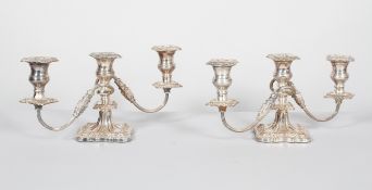 A pair of Victorian Sheffield plated three light candelabra, late 19th century,