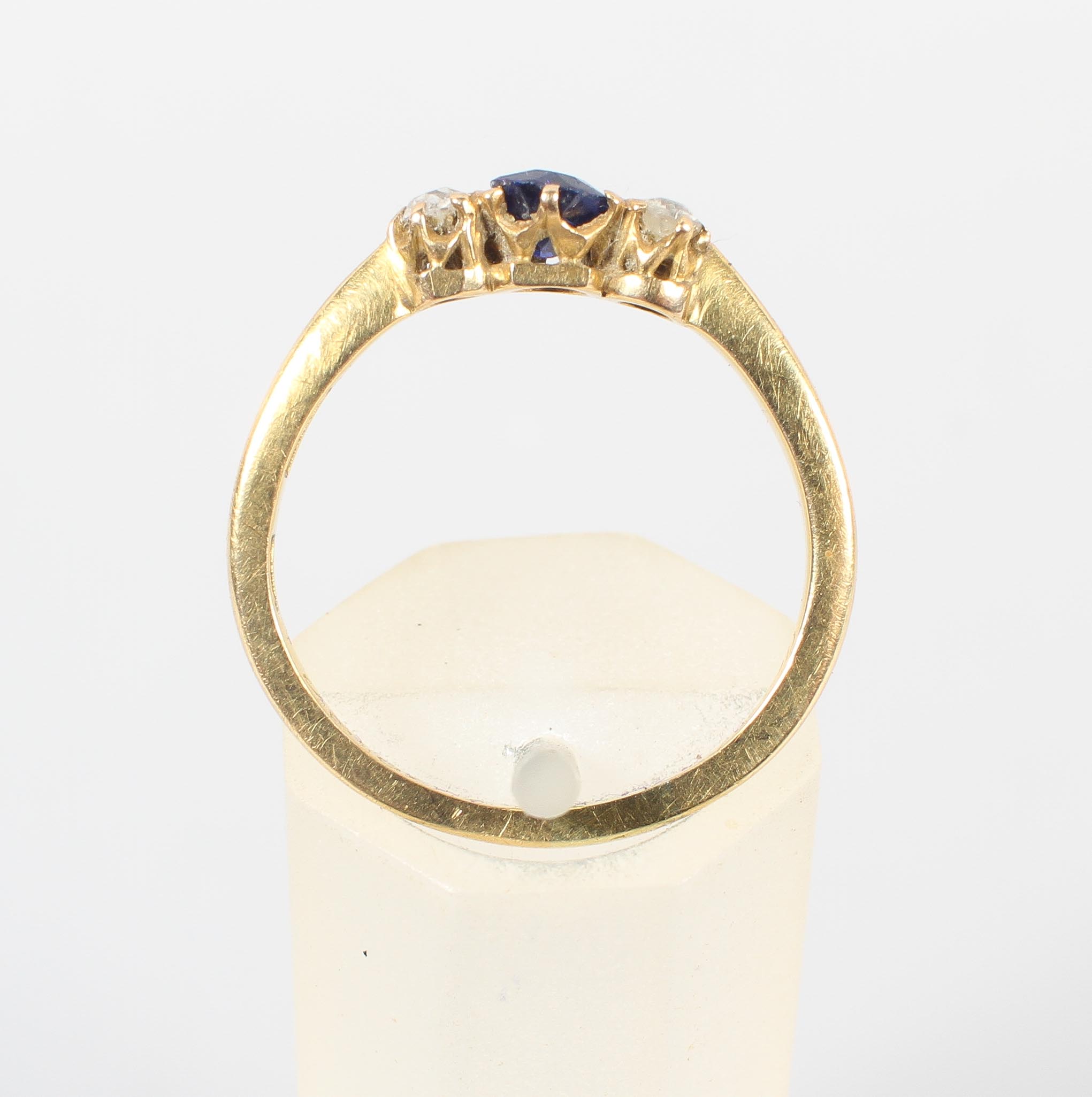 A yellow metal three stone ring. - Image 2 of 3