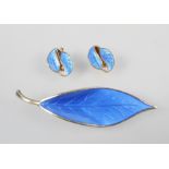 A David Andersen brooch and earrings set stylized as leaves with blue enamel finish.