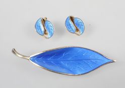 A David Andersen brooch and earrings set stylized as leaves with blue enamel finish.