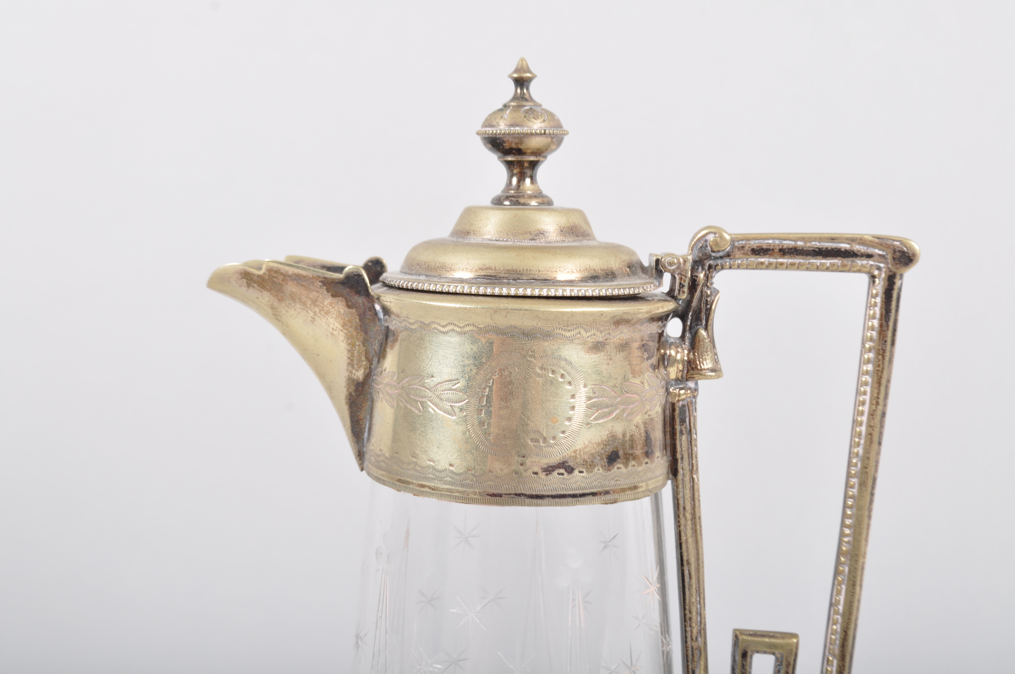 A silver plated engraved glass claret jug, circa 1890, the mounts engraved with laurel motifs, - Image 2 of 2