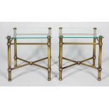 A pair of brass and glass occasional tables, of tubular construction with X form stretchers,