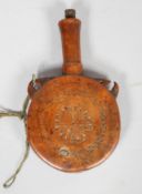 A treen, carved walnut powder flask and stopper, with tall tapering neck,