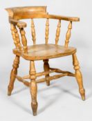 An ash tub shaped Windsor kitchen armchair with turned baluster back rest and elm urned top rail,