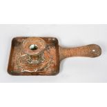 An Arts and Crafts Newlyn school copper chamberstick, circa 1900-05, of square panelled form,