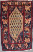 An Iranian 20th century wool rug, with central beige medallion