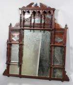 A late Victorian carved mahogany mirrored shelf,
