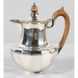 A small silver coffee pot, of multi panelled baluster form,