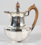 A small silver coffee pot, of multi panelled baluster form,