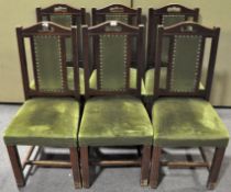 Six green upholstered dining chairs