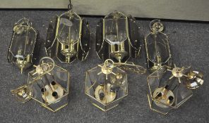 A group of brass and glass ceiling lanterns