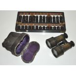 A set of opera glasses and an abacus