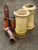 A collection of chimney pots. Largest measuring 65cm high and 38 wide.