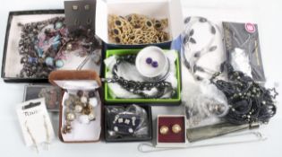 A mixed lot of boxed costume jewellery