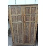 An oak two door wardrobe 152 cm high