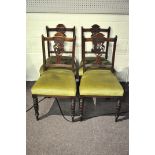 A set of four mahogany carved splat back dining chairs with upholstered seat