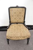 A Victorian ebonised nursing chair 83cm x 57cm